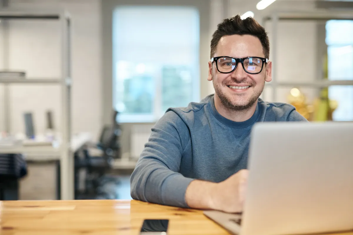 Service business owner reviewing AI search results for his company on a laptop