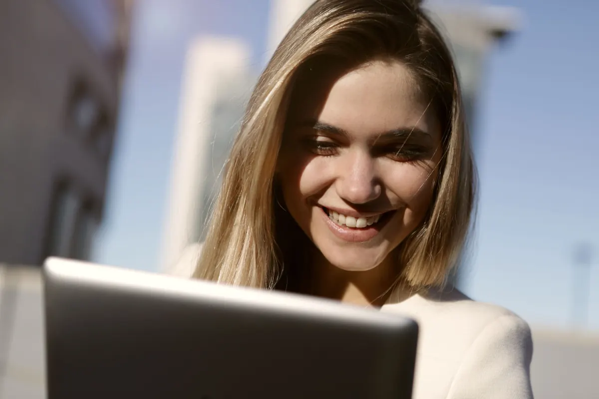 Service business professional smiling while reviewing search results on a tablet